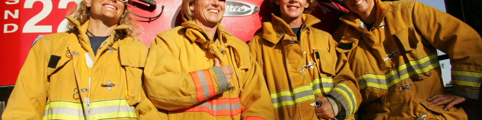 Firefighter Robyn with other firefighter teammates